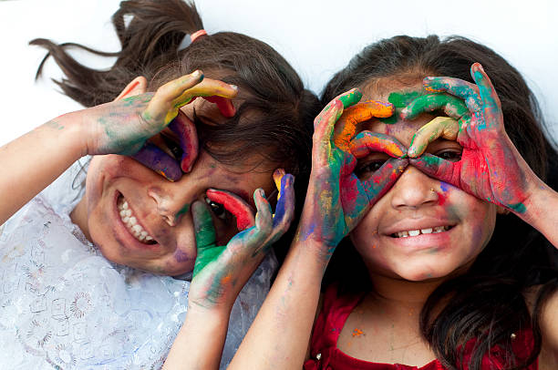 istock Small girls playing with colors 481552623