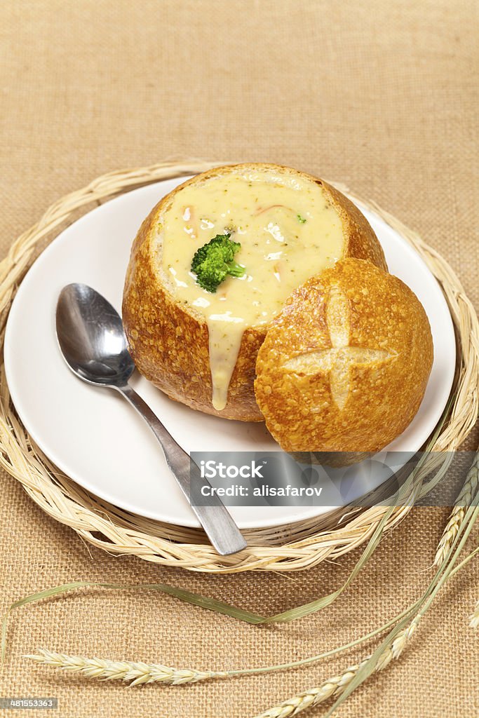 Broccoli and cheese soup Sourdough bread bowl filled with broccoli cheese soup Soup Stock Photo