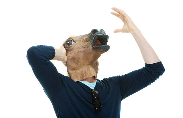 frustrato uomo informale in costume da cavallo - horse men animal head bizarre foto e immagini stock
