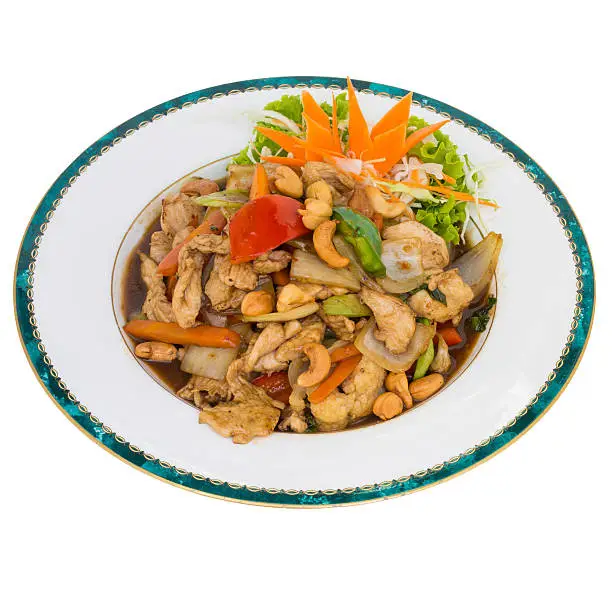 chicken with cashewnuts stir fry isolated on white background