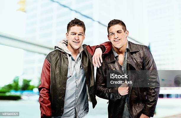 Two Men Standing On Urban Scene Stock Photo - Download Image Now - 16-17 Years, 18-19 Years, Adult