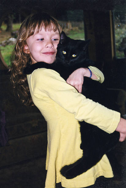 istock Girl and her cat 481560434