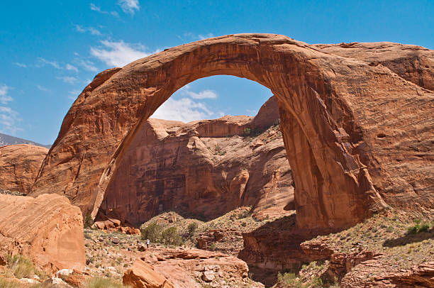 istock Hikers At Rainbow Arch, Arches National Park, Utah 481560890