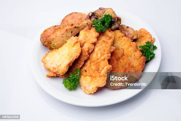 Breaded Pork Chops And Chicken Legs On Plate Stock Photo - Download Image Now - 2015, Animal Body Part, Animal Leg