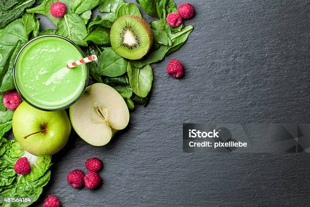 Green Smoothie With Fruits And Vegetables On Black Background Stock Photo - Download Image Now