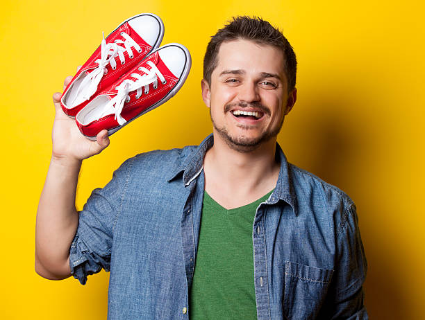 istock young smiling guy in shirt with red gumshoes 481564556