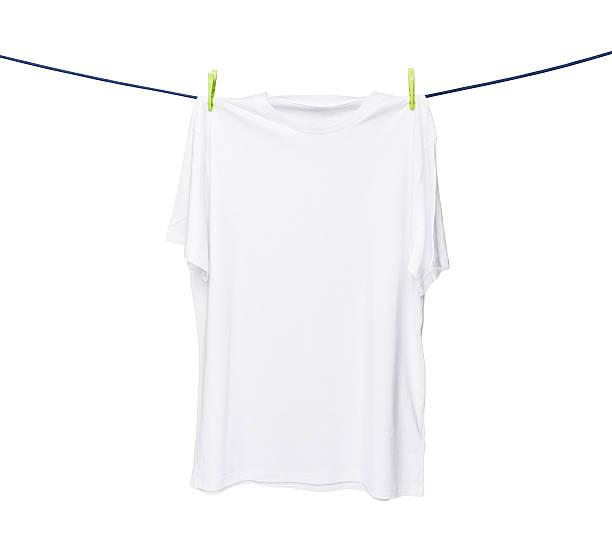 istock white t-shirt on the rope. Isolated on white background. 481565578