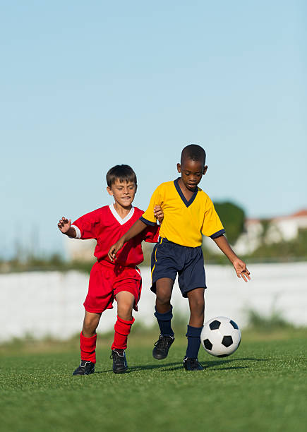 istock Two Young Boys Playing Football 481566121