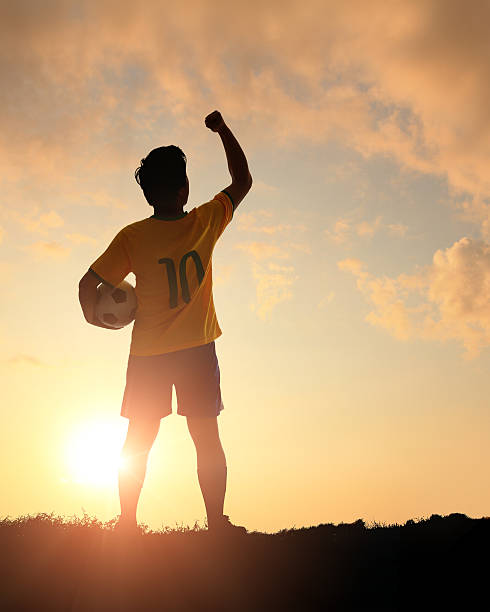 istock Man and soccer silhouette 481566261
