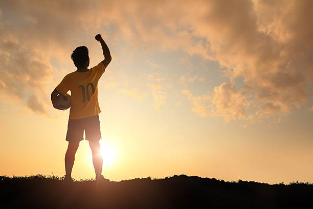 Man and soccer silhouette Man and soccer silhouette, Brazil soccer player man with ball look sunlight football2014 stock pictures, royalty-free photos & images