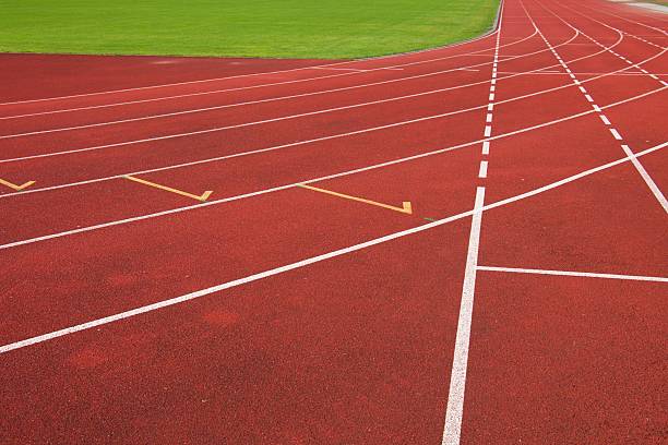 istock Red running racetrack on the athletic stadium 481567058