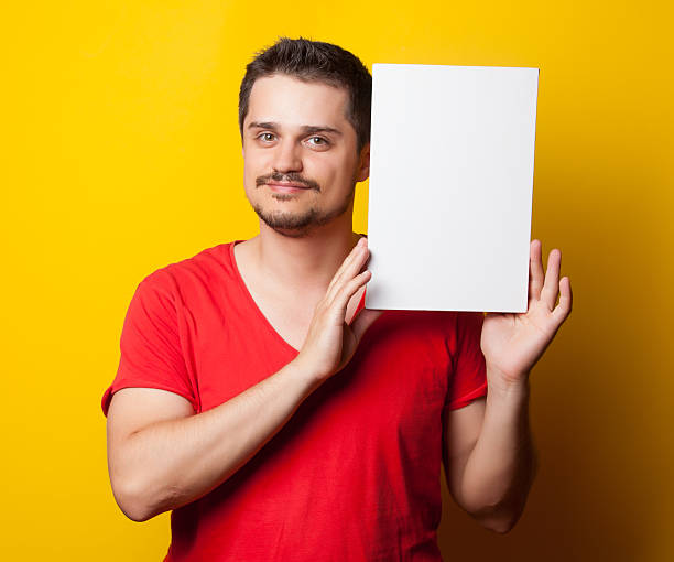istock guy in t-shirt with white board 481567294