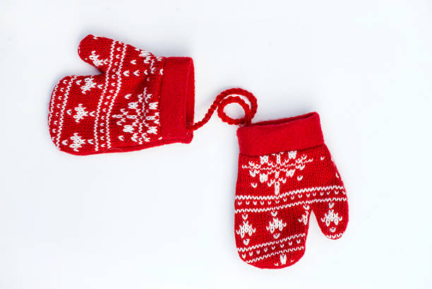 Christmas Red Knitted Mittens with Snowflake Motives on white background