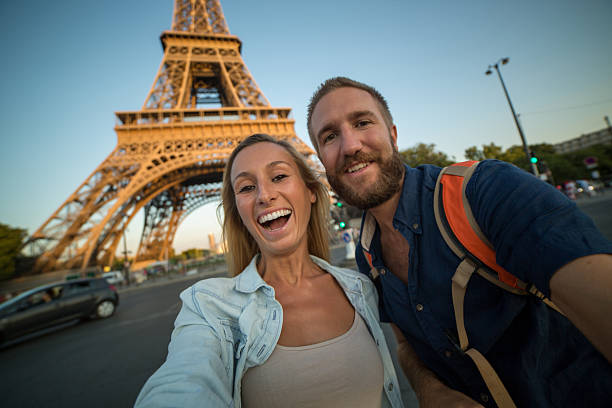 istock Young couple visiting Paris taking selfie at sunset 481567960