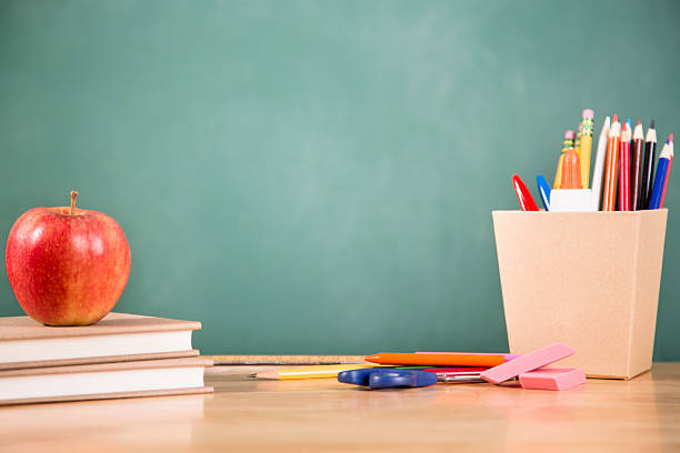 istock Back to school. School supplies, apple on desk. Education. 481568090