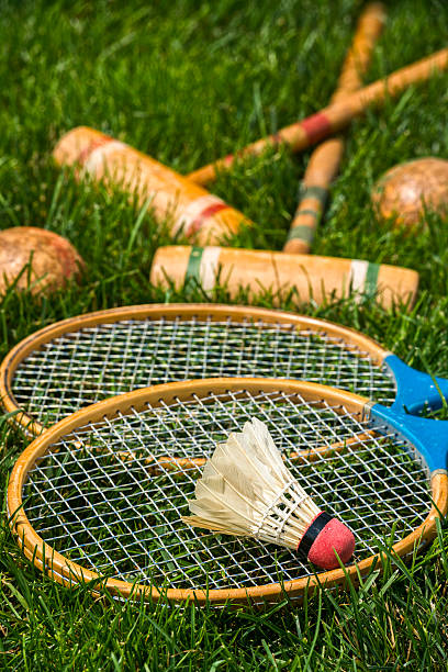 istock Vintage badminton rackets and shuttlecock lying in grass 481568486