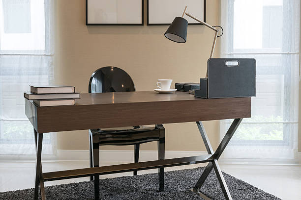 istock wooden table and books in modern working room interior 481571102