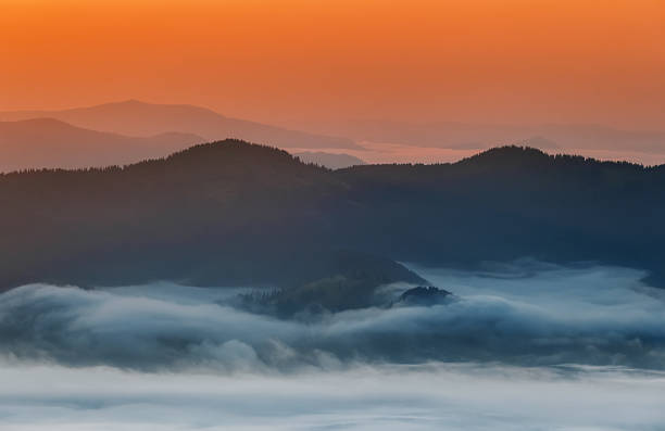 istock Carpathian Mountains. Mountains covered in mist at sunrise 481571220