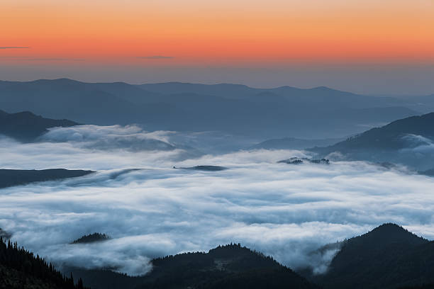 istock Carpathian Mountains. Mountains covered in mist at sunrise 481571524
