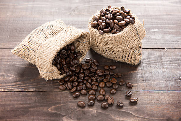istock coffee beans in a bag on wooden background 481571946