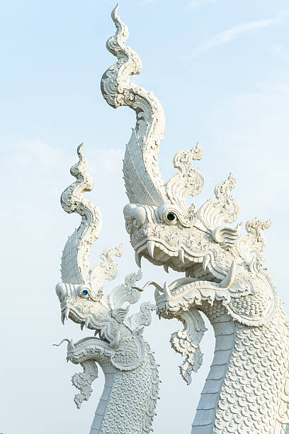 istock white serpent head of naga statue on blue sky background 481572486