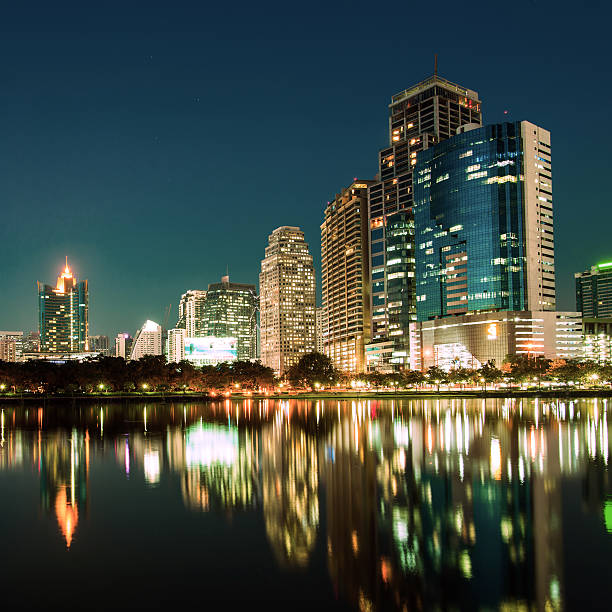istock City downtown at night with reflection of skyline 481574905