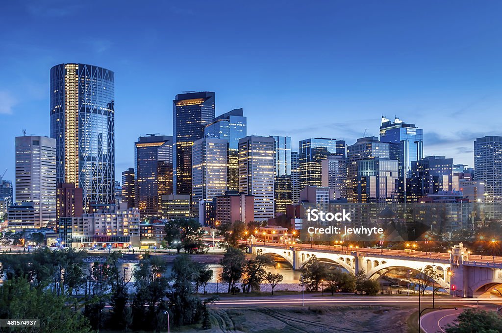 Calgary skyline Calgary skyline at night with Bow River and Centre Street Bridge. City Stock Photo