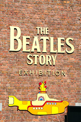 Liverpool, United Kingdom - June 11, 2015: The Beatles Story exhibition building and yellow submarine at Albert Dock, Liverpool, Merseyside, England, UK, Western Europe.