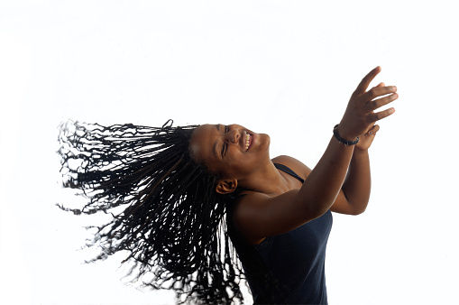Young black teenager woman dancing
