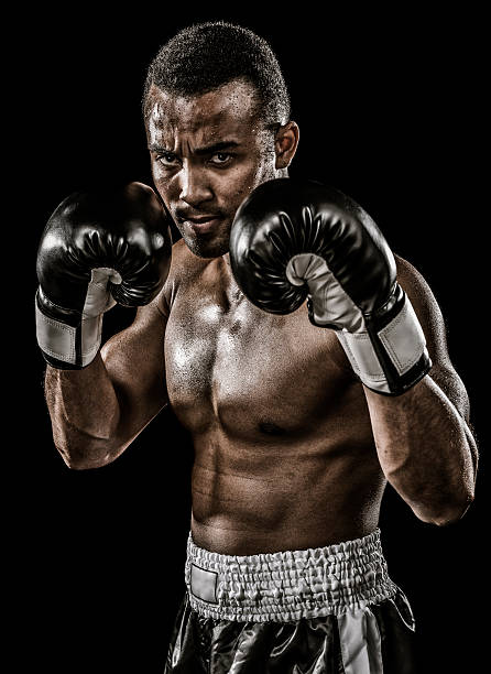 Real boxer African descent boxer isolated on black background boxer stock pictures, royalty-free photos & images