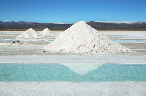 Salt piles and water pool on Salinas Grandes salt flats in Jujuy province, northern Argentina.
