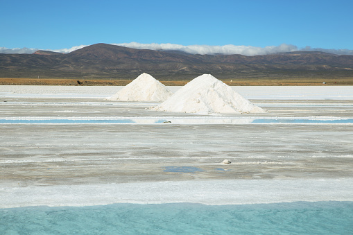 Salt piles and water pool on Salinas Grandes salt flats in Jujuy province, northern Argentina.