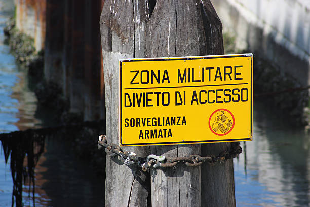 Military Zone Sign Venice Dangerous zone. Military Zone Sign in Venice, Italy Europe impassable limit stock pictures, royalty-free photos & images