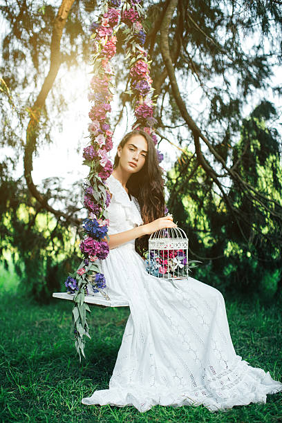 istock Beautiful young girl on a swing 481579758
