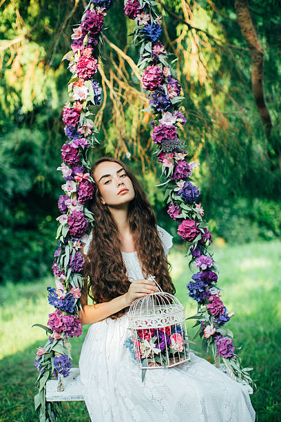 istock Beautiful young girl on a swing 481579760