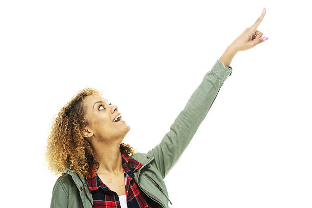 istock Smiling female woman pointing away 481586152