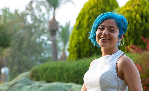 one young woman only There are blue-haired young woman.Young woman is smiling. prom stock pictures, royalty-free photos & images
