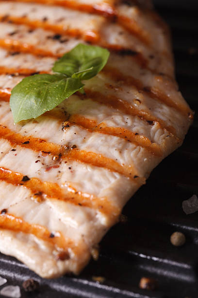 istock Chicken breast with basil on the grill macro. vertical 481608660