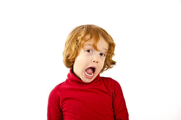 istock red hair child surprised isolated on white background 481609546