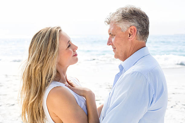 istock Happy couple standing by the sea 481610468