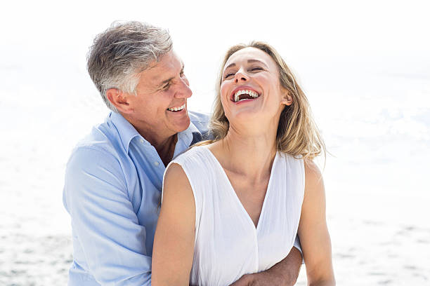 istock Happy couple laughing together 481610494