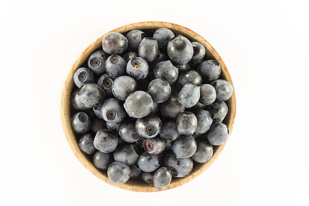 istock Blueberries in a wooden round shape 481610956