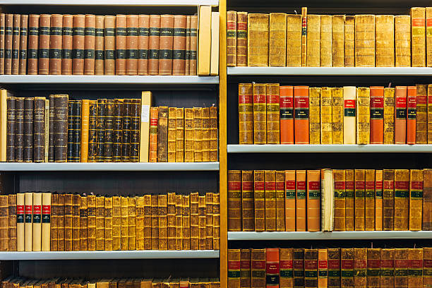 Stack of old, vintage books backlit by the sun