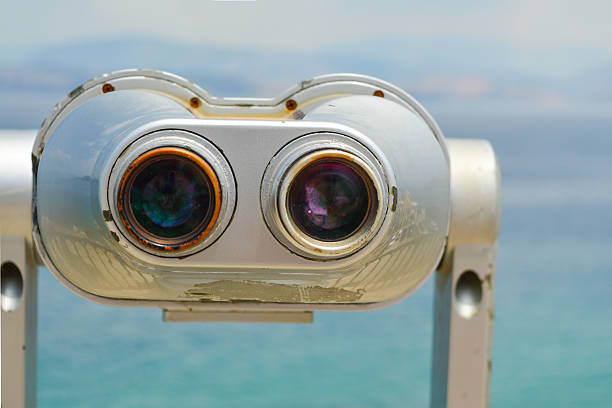 istock Public binoculars looking at the clear blue sea 481611212