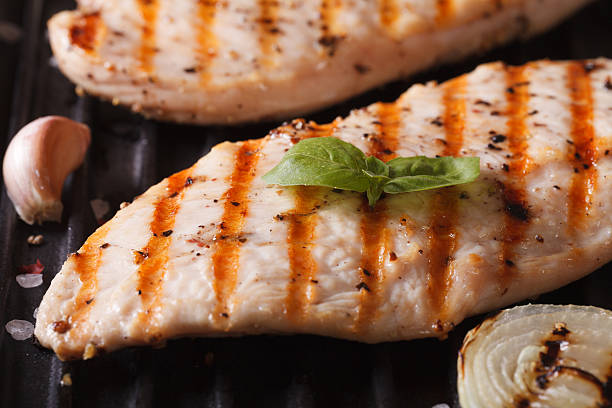 istock Chicken fillet with onion on a grill macro. horizontal 481614138