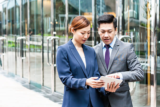 istock Two business people looking on tablet 481614222