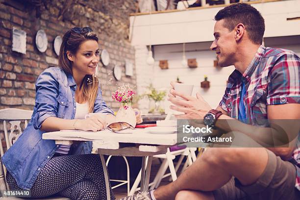 Young Happy Couple Sitting At Cafe Stock Photo - Download Image Now - 2015, Adult, Beautiful People