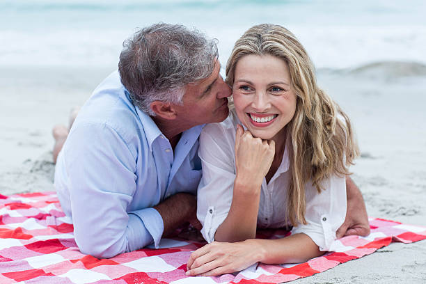 istock Happy couple lying on a blanket and kissing 481615048