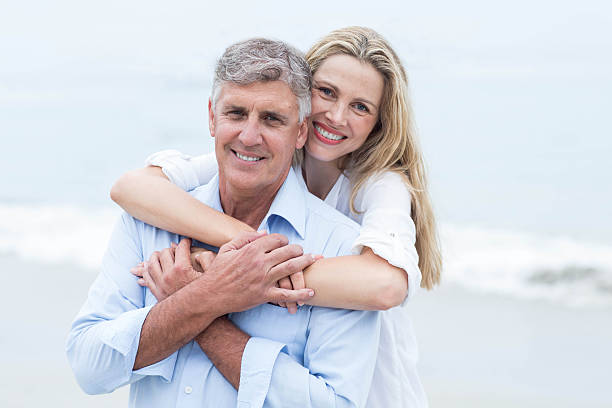 istock Happy couple hugging each other and looking at camera 481615452