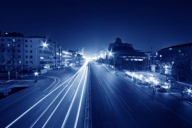 istock light trails on the modern street at night 481615669